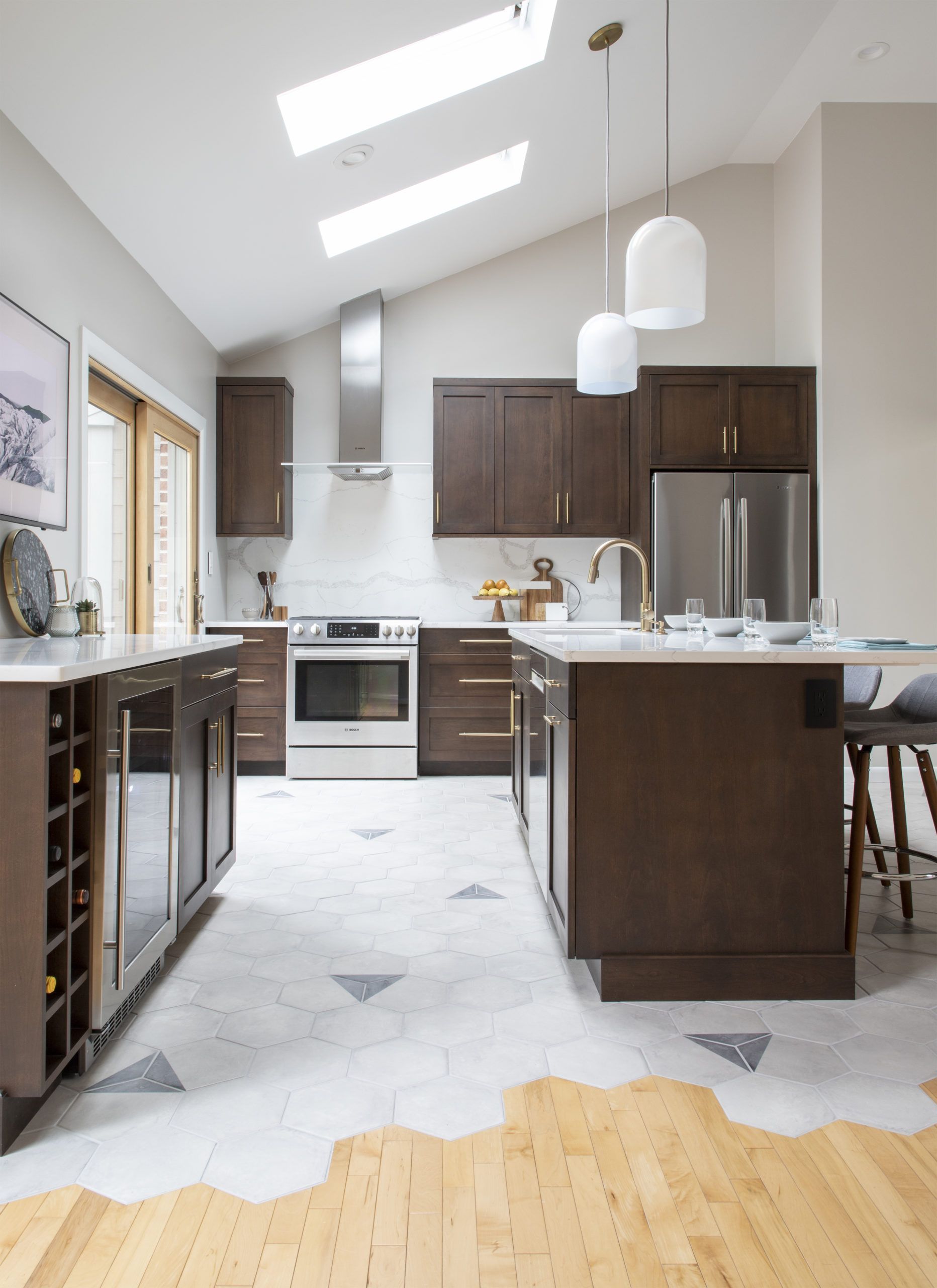 A kitchen with stainless steel appliances and wooden cabinets