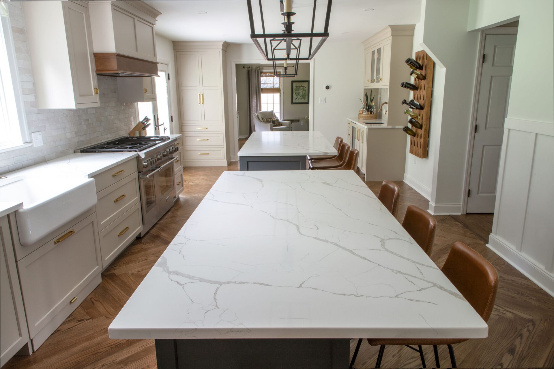 A kitchen with a large island and a dining table.