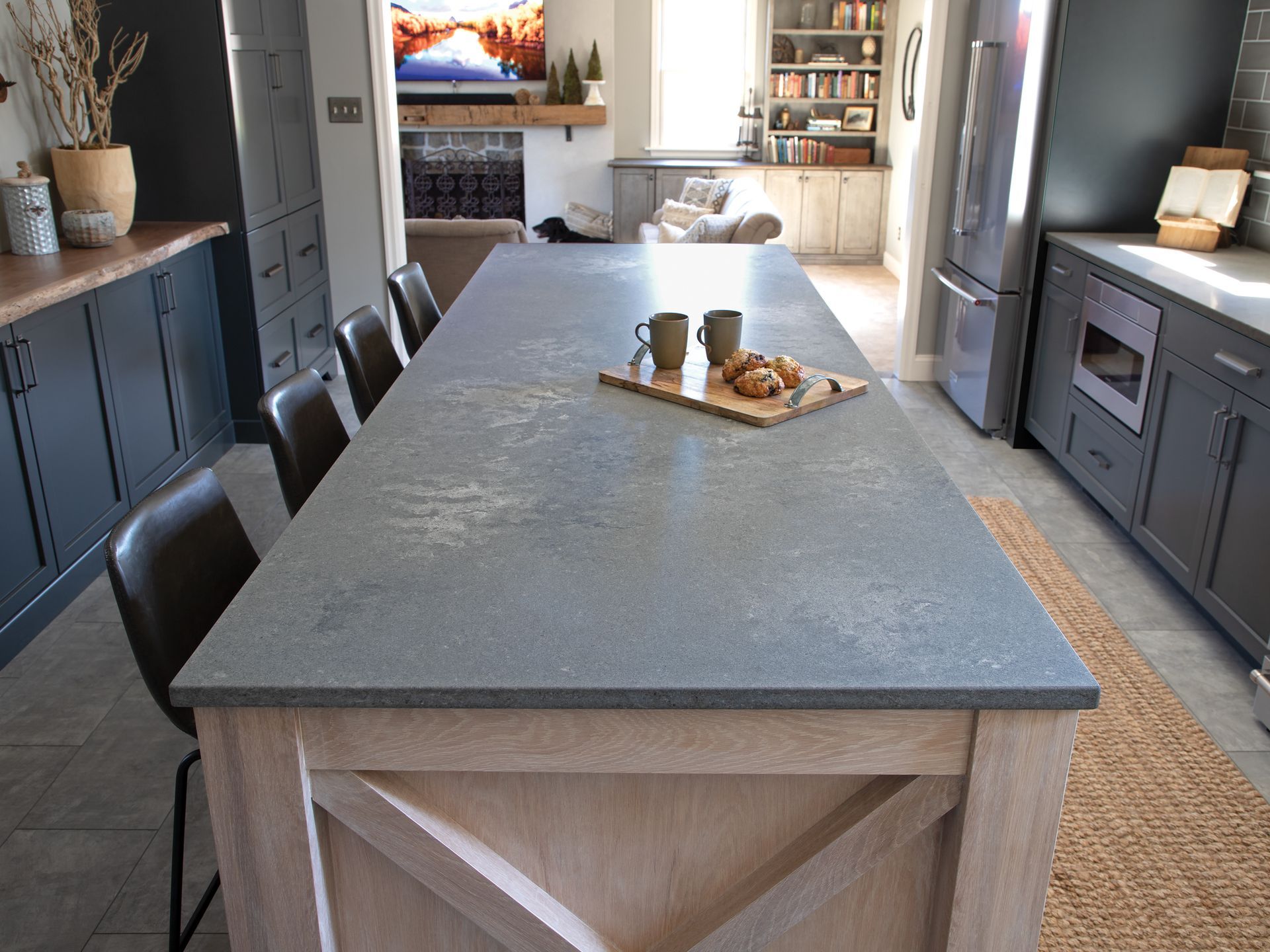 A kitchen with a large island and a tray of food on it