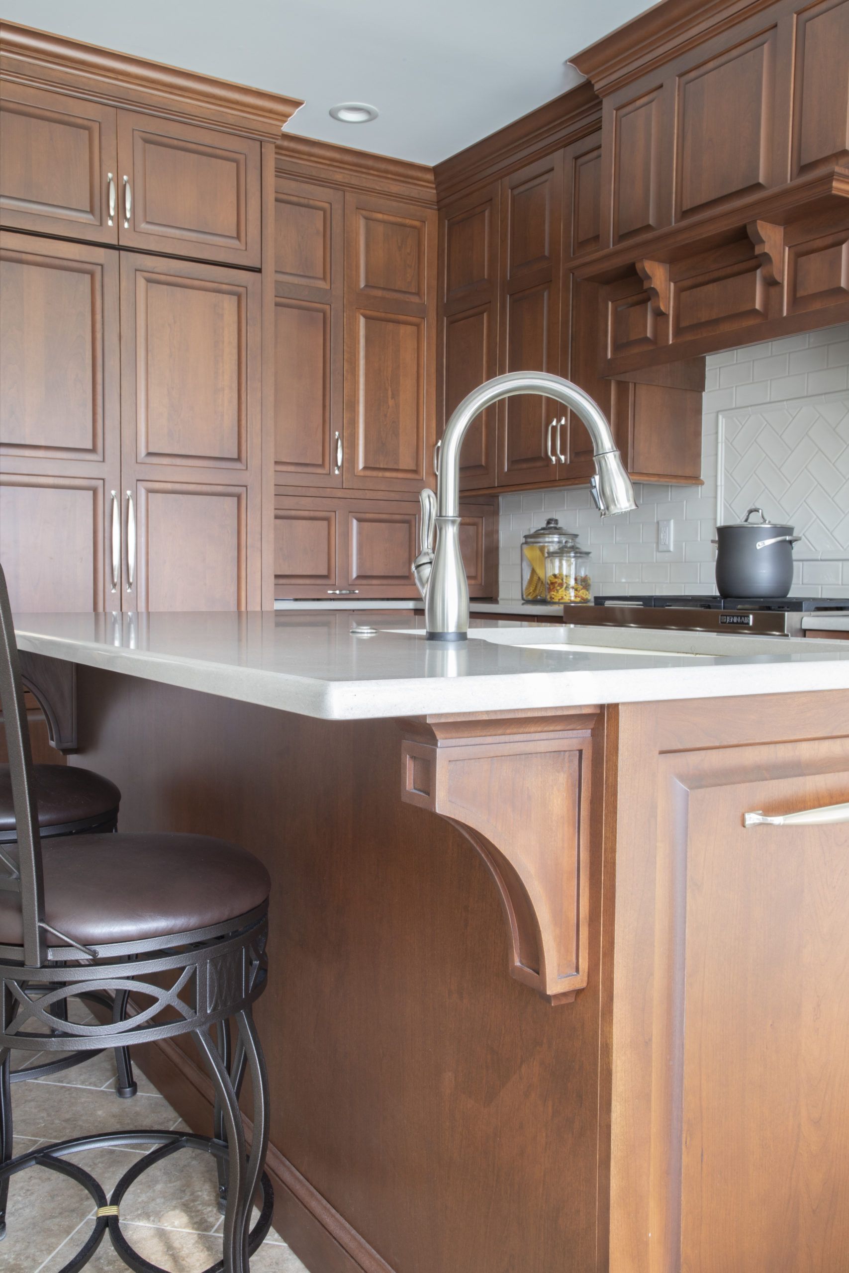 A kitchen with wooden cabinets and a sink