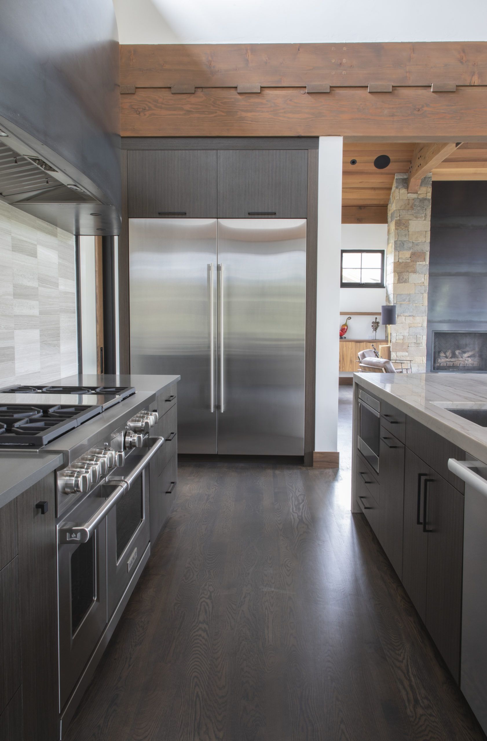 A kitchen with stainless steel appliances and wooden cabinets