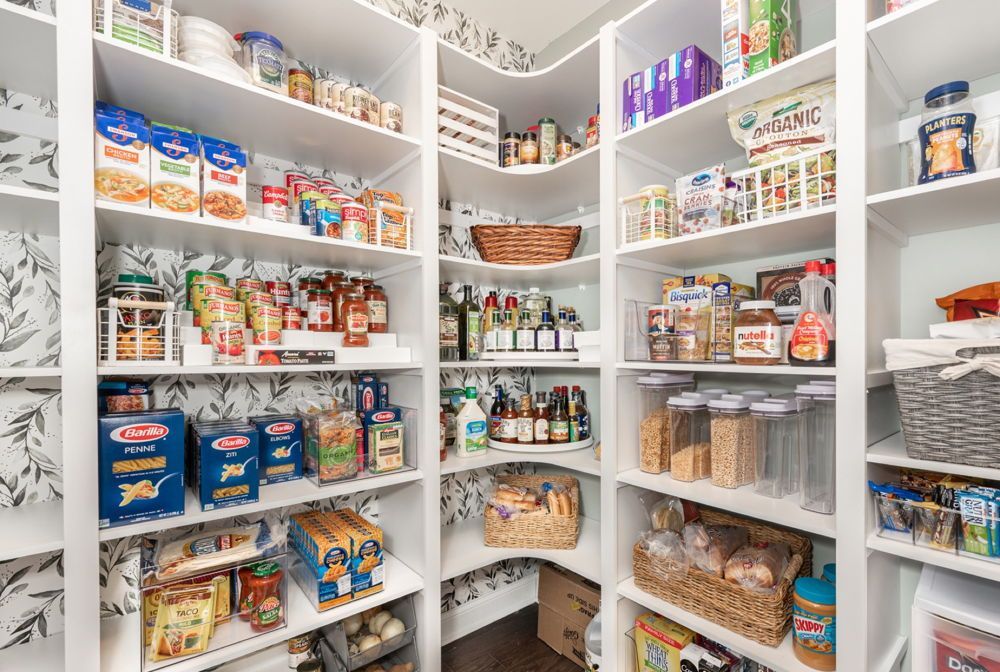 A kitchen pantry filled with lots of food and utensils