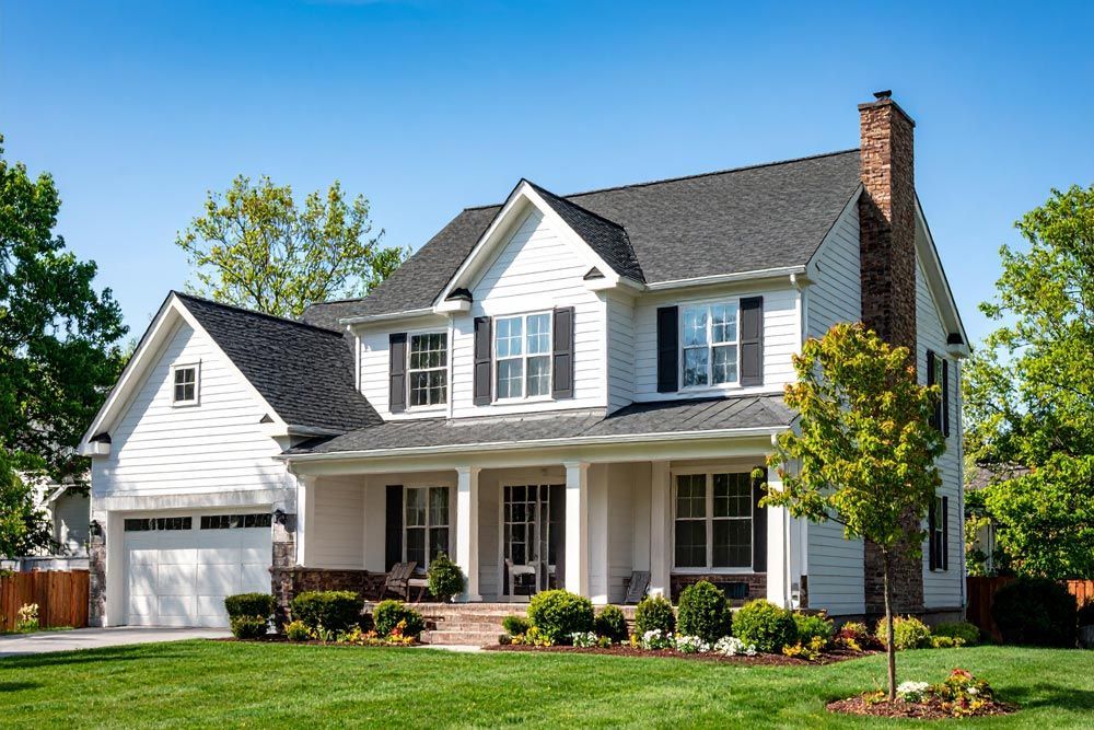 A large two story white house in Lancaster, PA