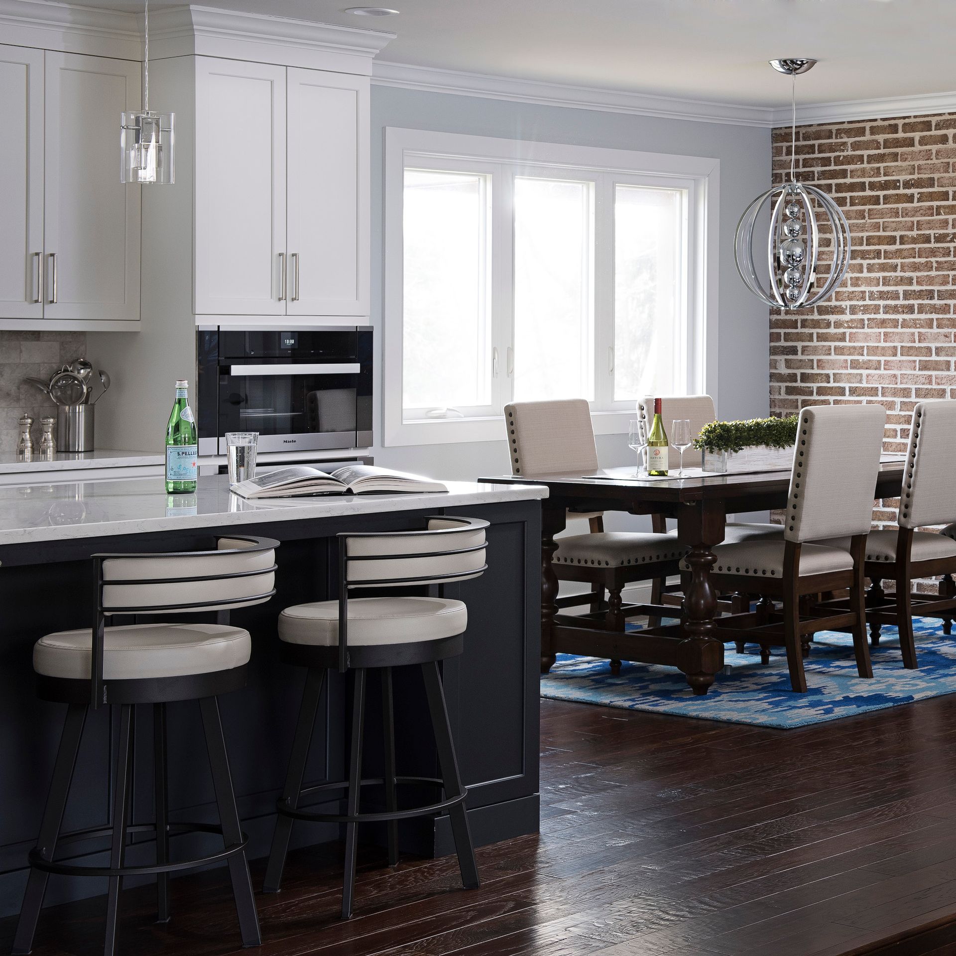 A kitchen with a table and chairs in it