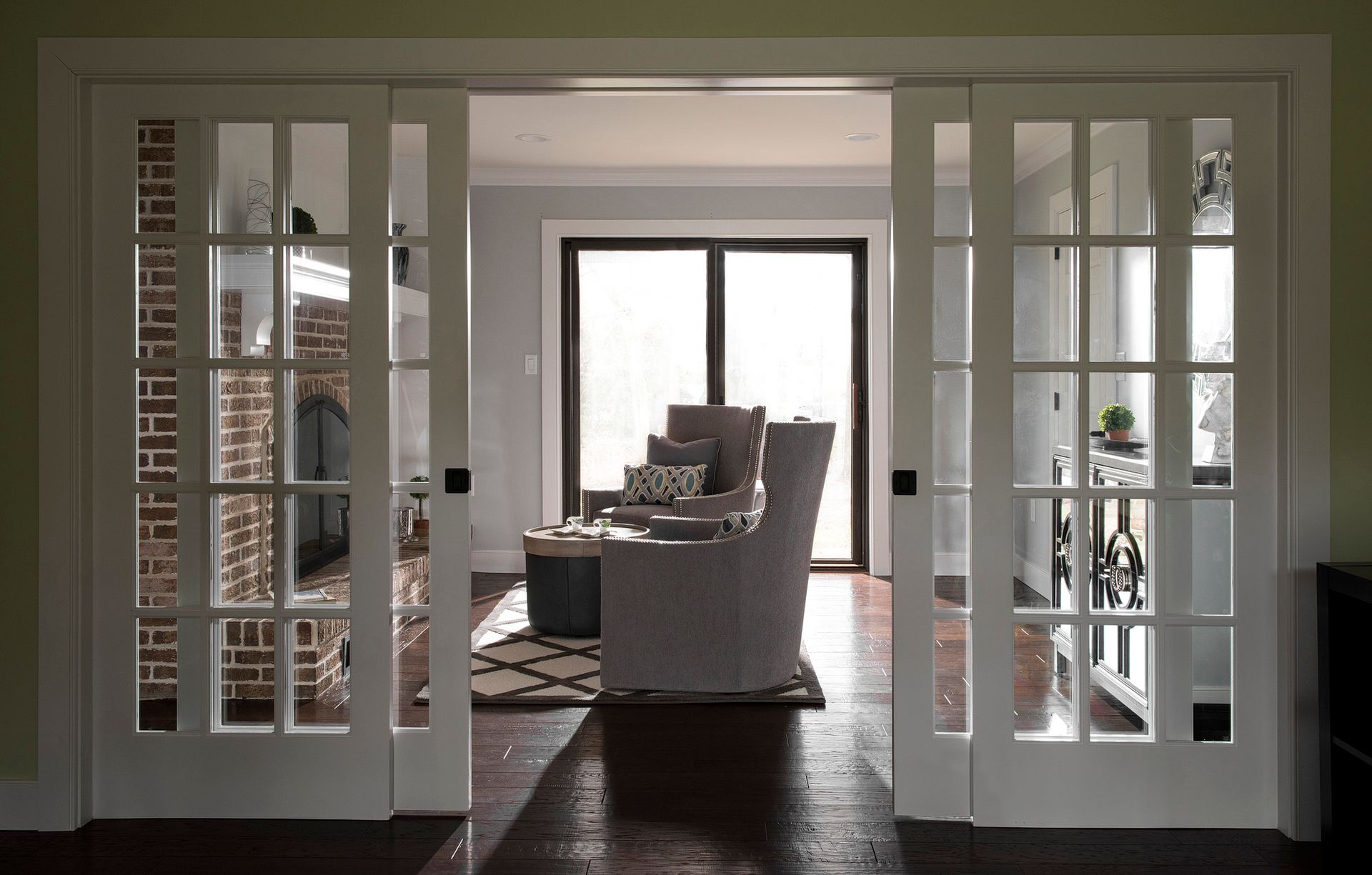 A living room with sliding glass doors leading to a patio