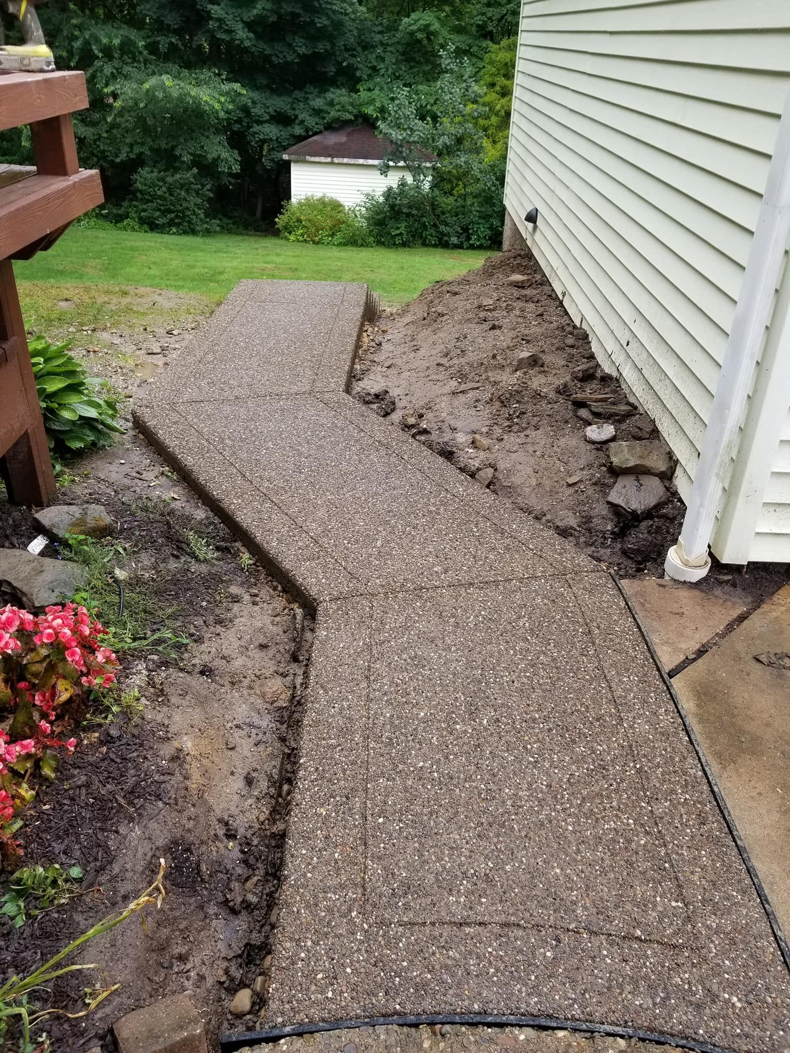 A brick walkway in a park with grass on the side, Allison Park, PA, USA, JCM Landscaping