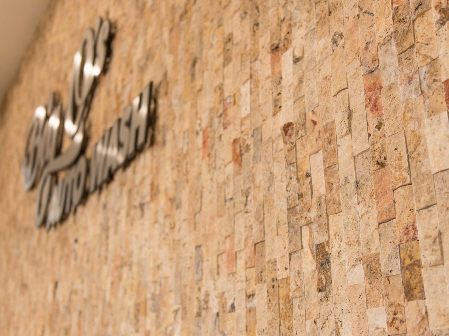 A close up of a wall with a sign on it