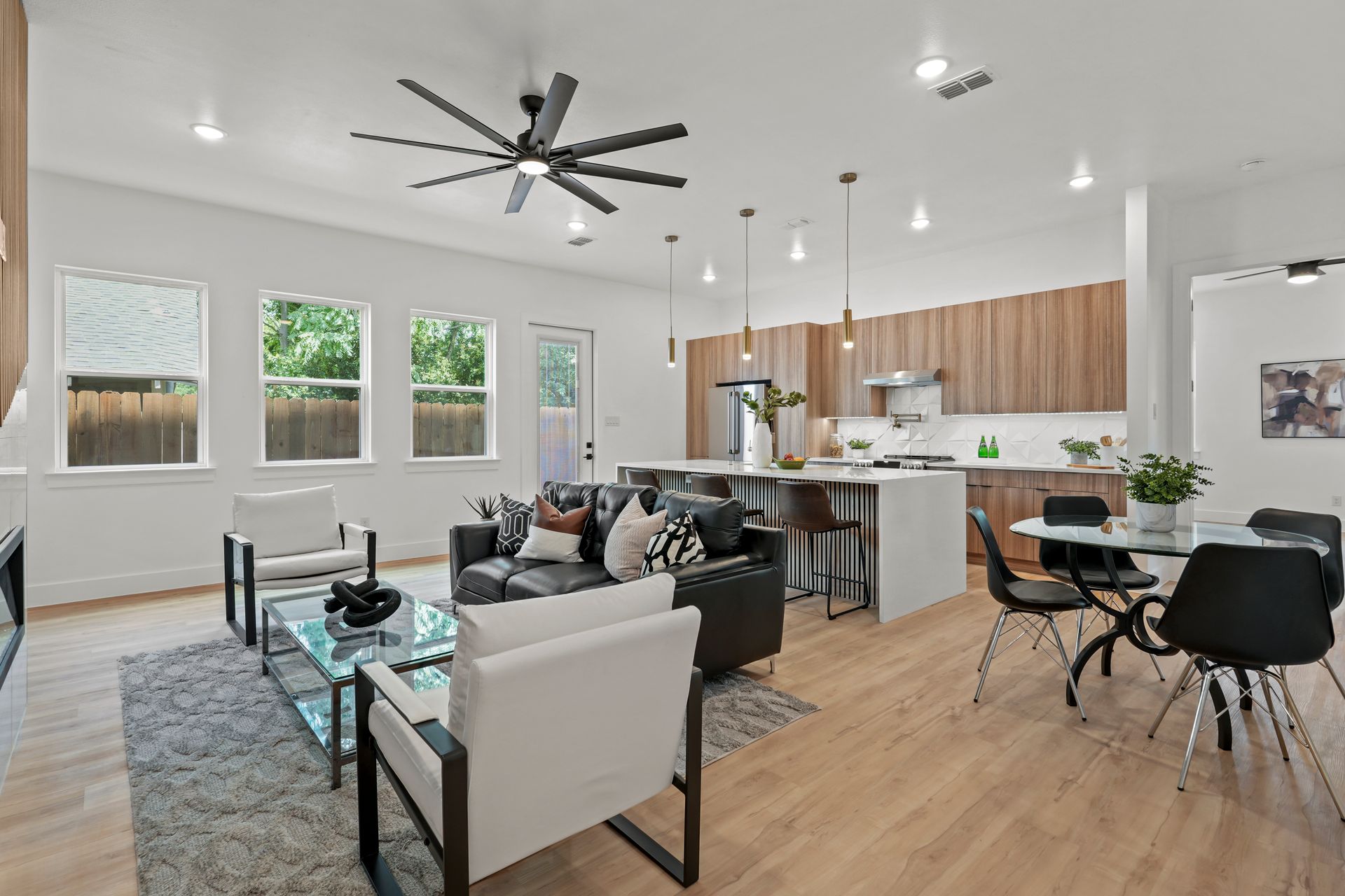 Open-concept living area with kitchen, living room, and dining space. 