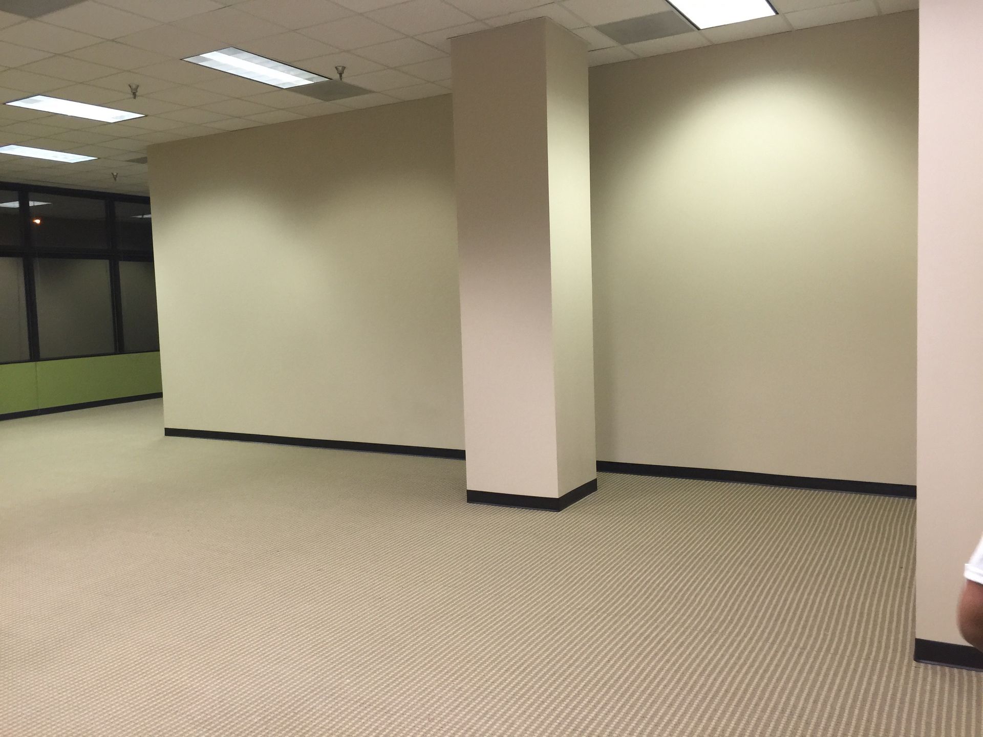 An empty room with a basketball on the floor
