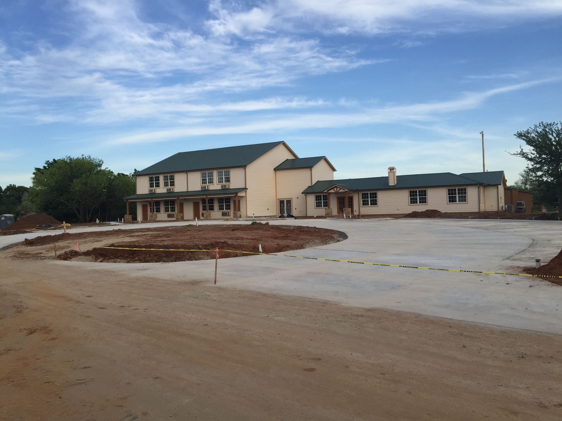 A large house with a lot of dirt in front of it