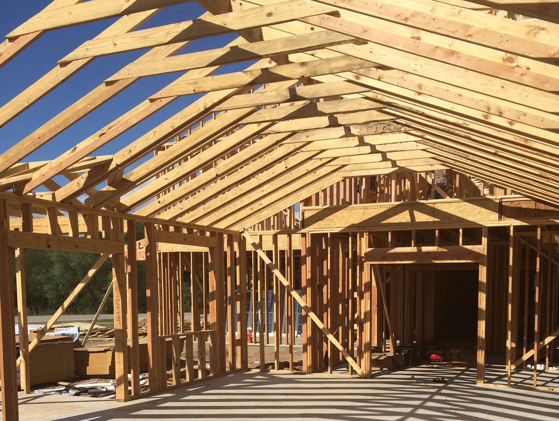 A house is being built with a lot of wooden beams.