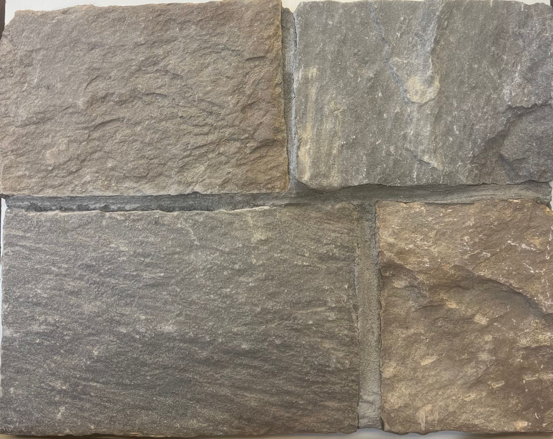 A close-up of a piece of stone that looks like a brick wall