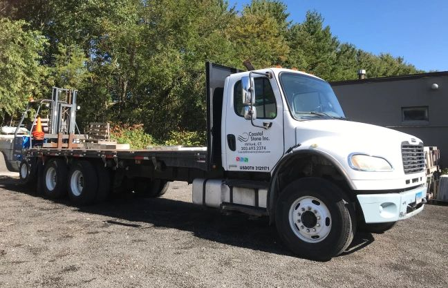 A pile of rocks stacked on top of each other in a field.