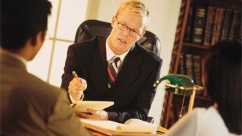 Lawyer consulting a couple - Legal Service in Florham Park, NJ