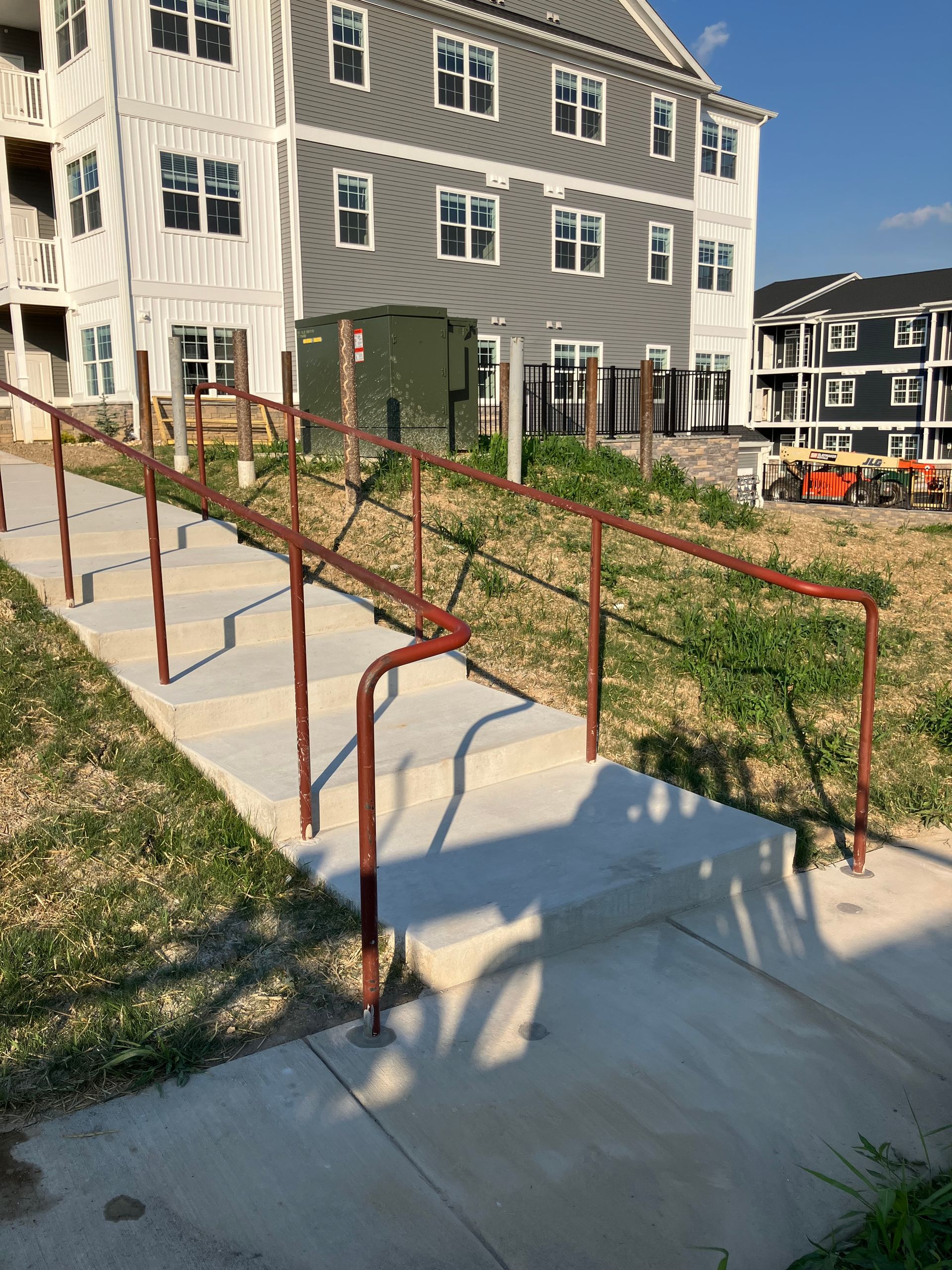 Stairs leading up to a building with a red railing