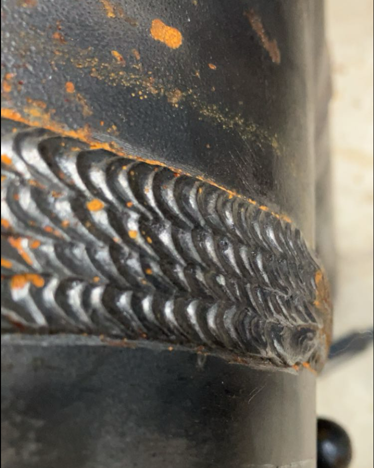 A close up of a piece of metal that looks like a tire