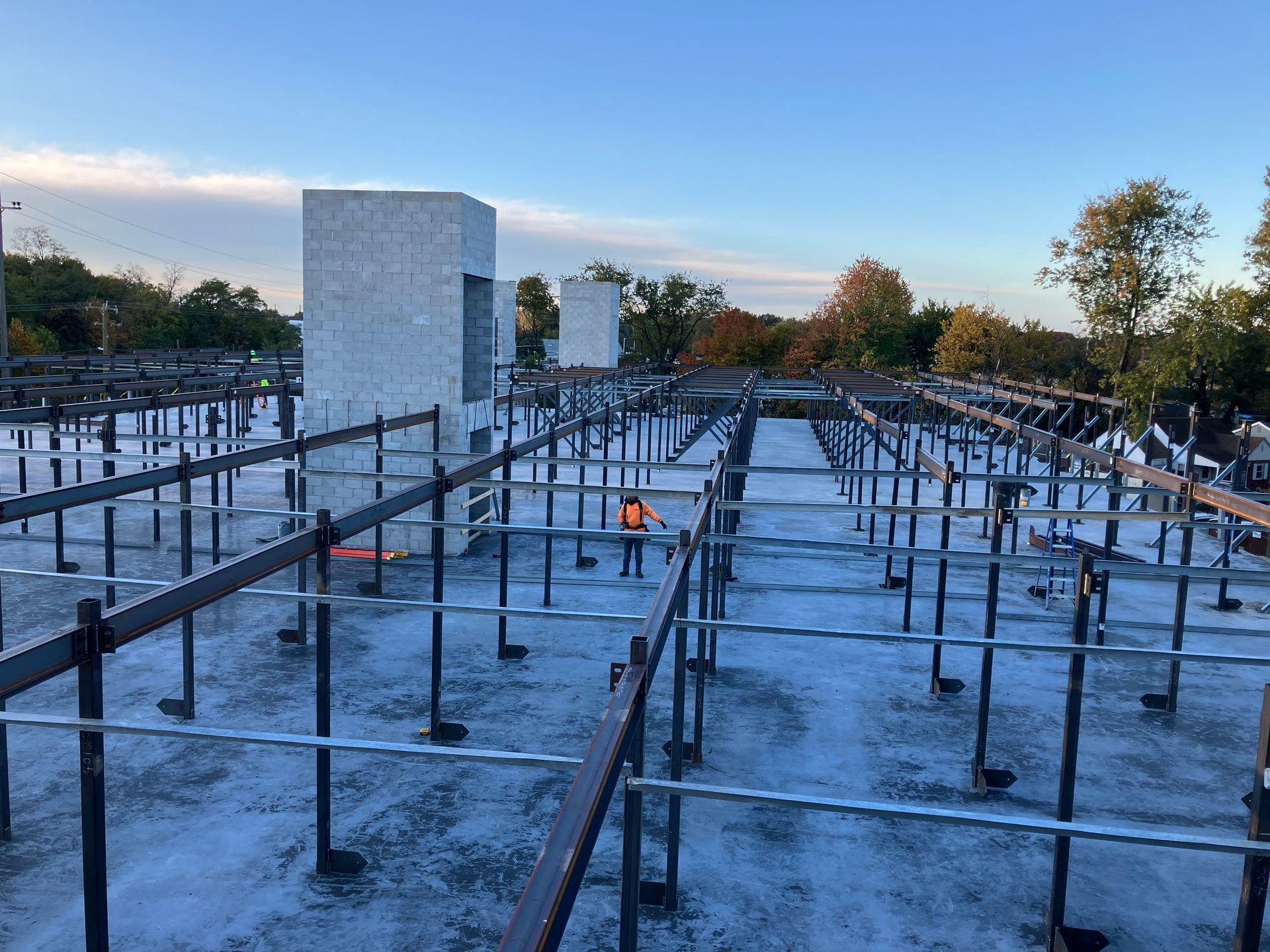 A construction site with a lot of metal bars on the ground.