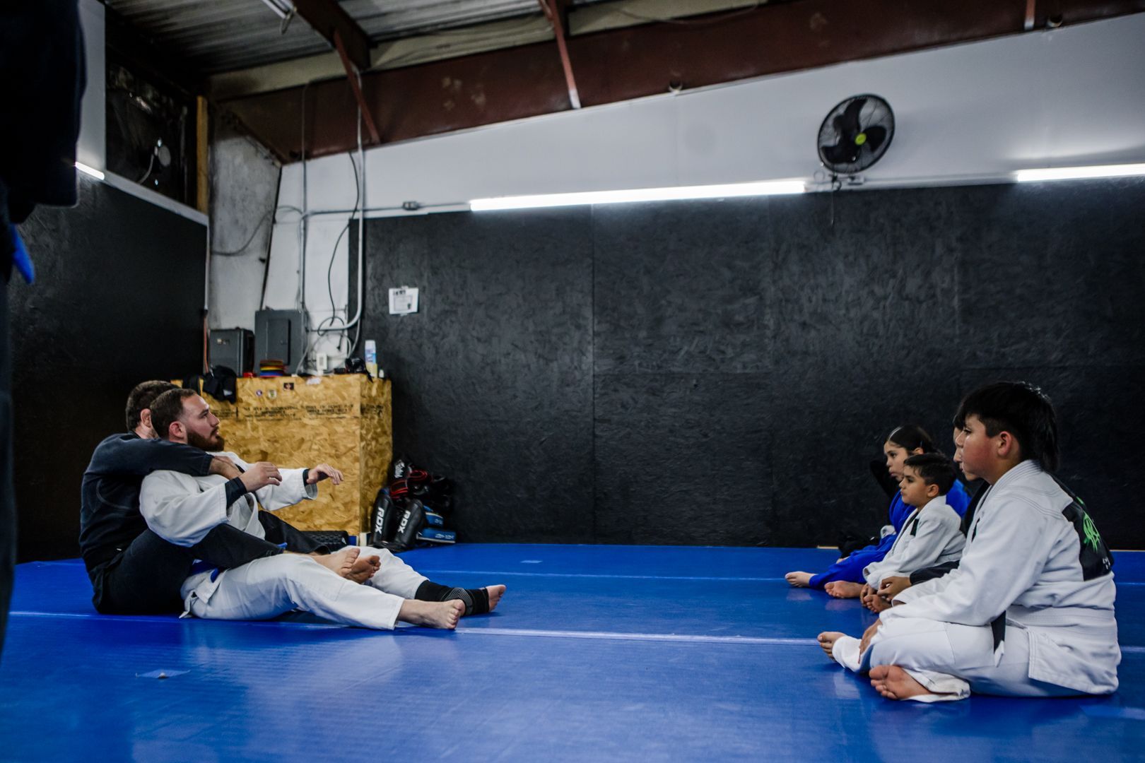 Students drilling Brazilian Jiu Jitsu escapes at Artistry BJJ in Houston, TX.