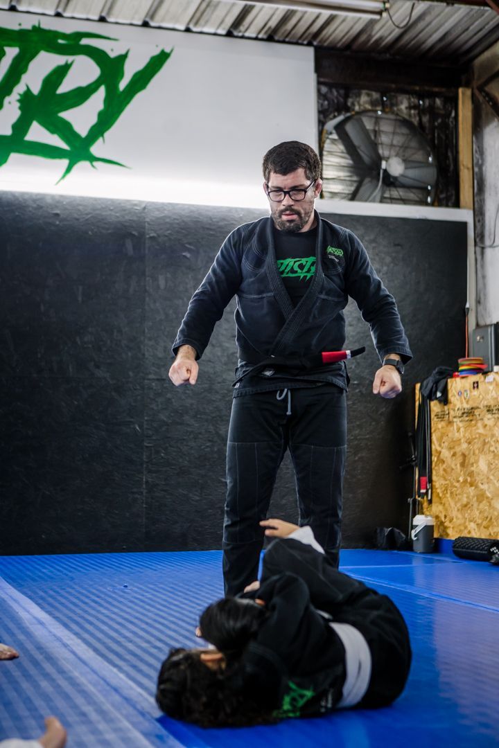 Students drill Brazilian Jiu Jitsu techniques at Artistry BJJ in Houston, TX to build calm.