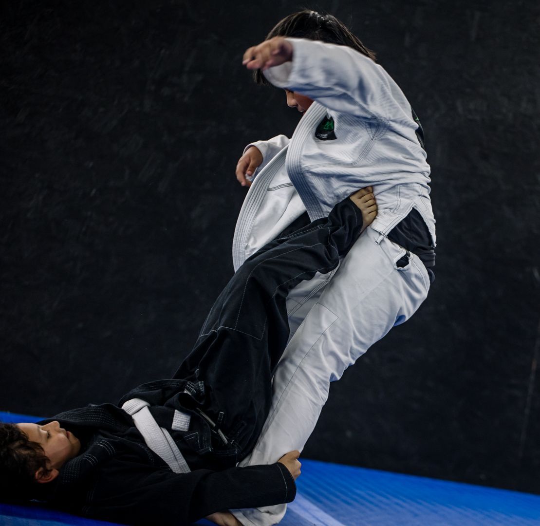 Kids practicing Youth Brazilian Jiu Jitsu drills at Artistry BJJ in Houston, Texas.