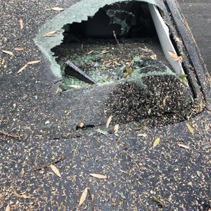 There is a hole in the roof of a car.