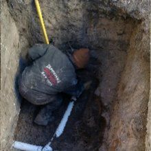 Sewer Line Inspection — Man Fixing a Sewer Line in Bay City, MI