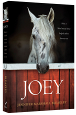 Book cover featuring a white horse peering over a red wooden fence, titled “JOEY” on a black background