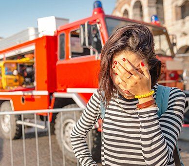 Fire Damage Restoration — Woman In Stress After Fire in Flagstaff, AZ