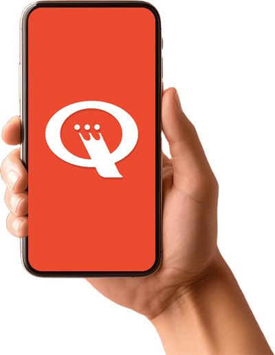 A hand is holding a cell phone with the letter q on the screen