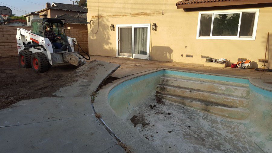 Empty Dirty Swimming Pool — Mira Loma, CA — Sneve Bobcat Service