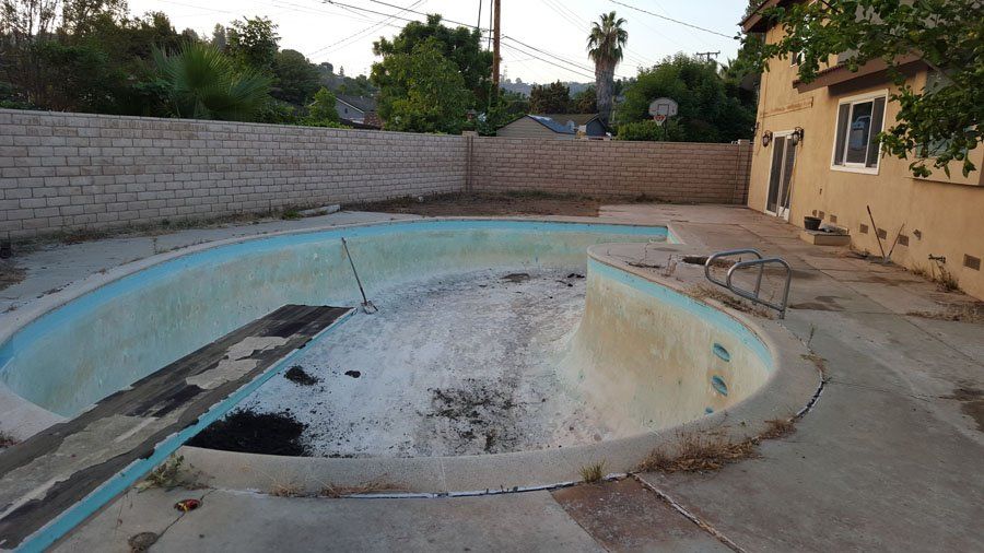 Residential Pool Before — Mira Loma, CA — Sneve Bobcat Service