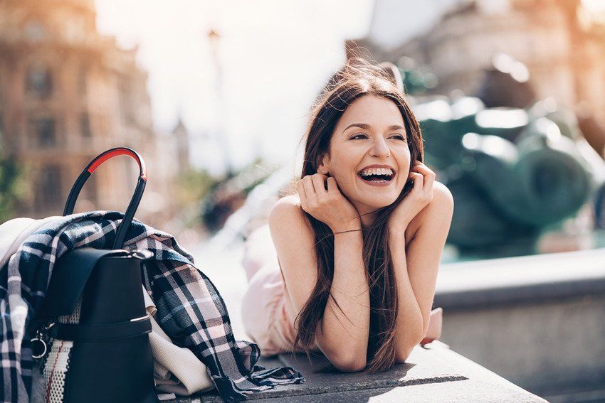 Happy young woman with braces