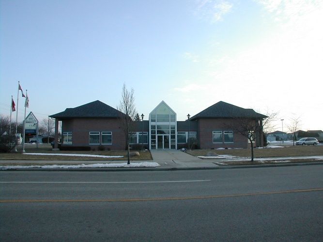 A large brick building with a glass front door