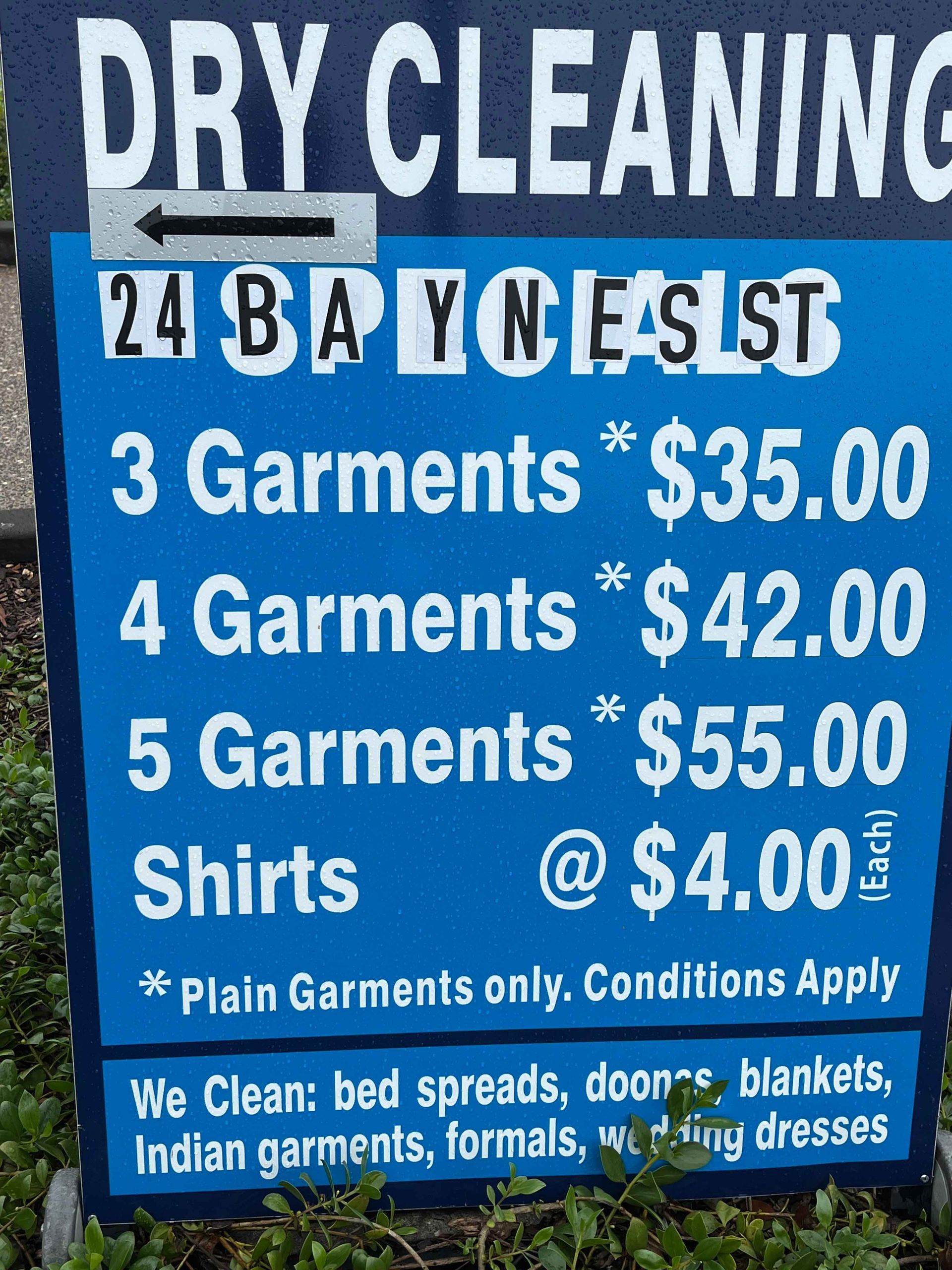 A Blue Sign That Says Dry Cleaning On It – Margate, QLD - Ocean Breeze Dry Cleaners