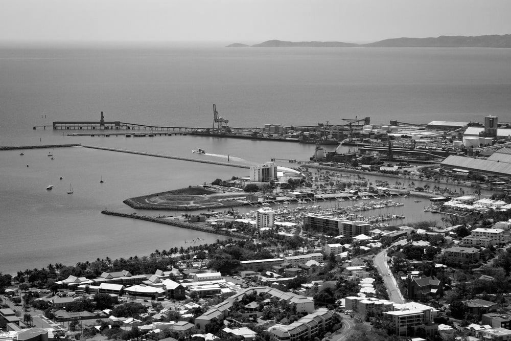 An Aerial View Of A City Next To The Ocean — Lux Noir In  Townsville City, QLD