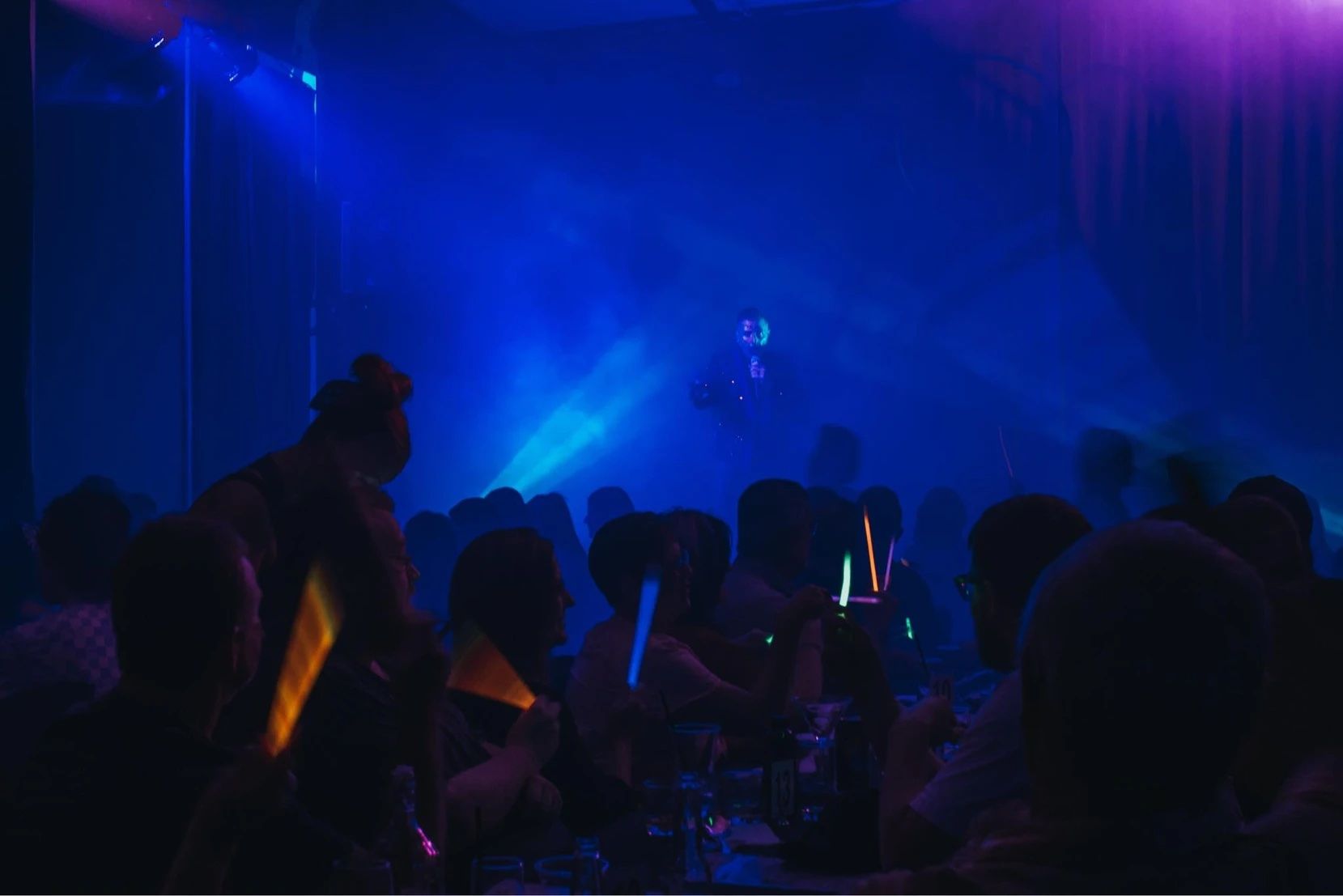 A Group Of People Are Toasting With Wine Glasses At A Bar — Lux Noir In  Townsville City, QLD
