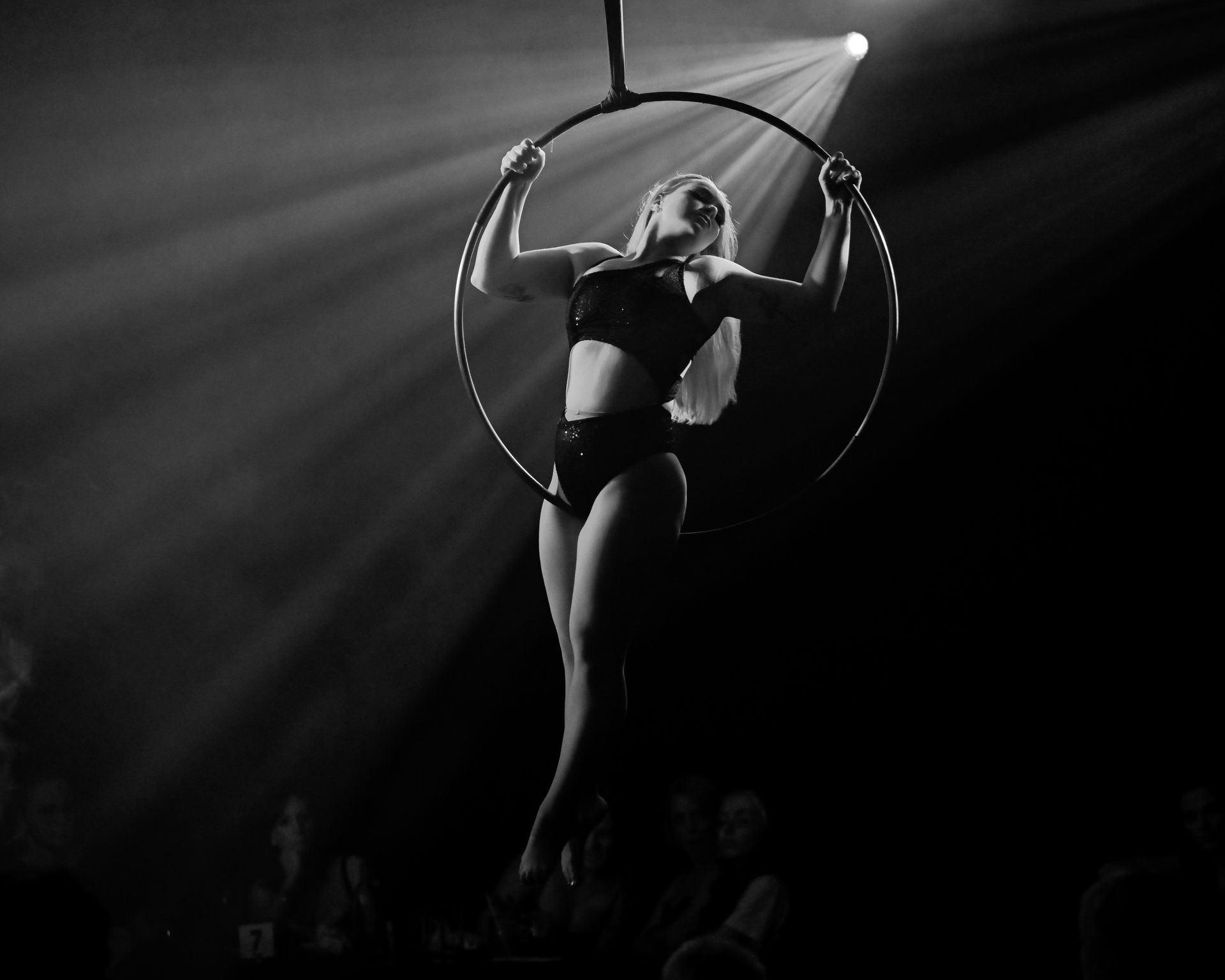 A black and white photo of a woman in an aerial hoop — Lux Noir in Townsville City, QLD