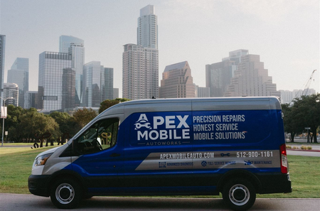 Blue and gray Apex Mobile van parked in front of an Austin, Texas skyline. | Apex Mobile Autoworks