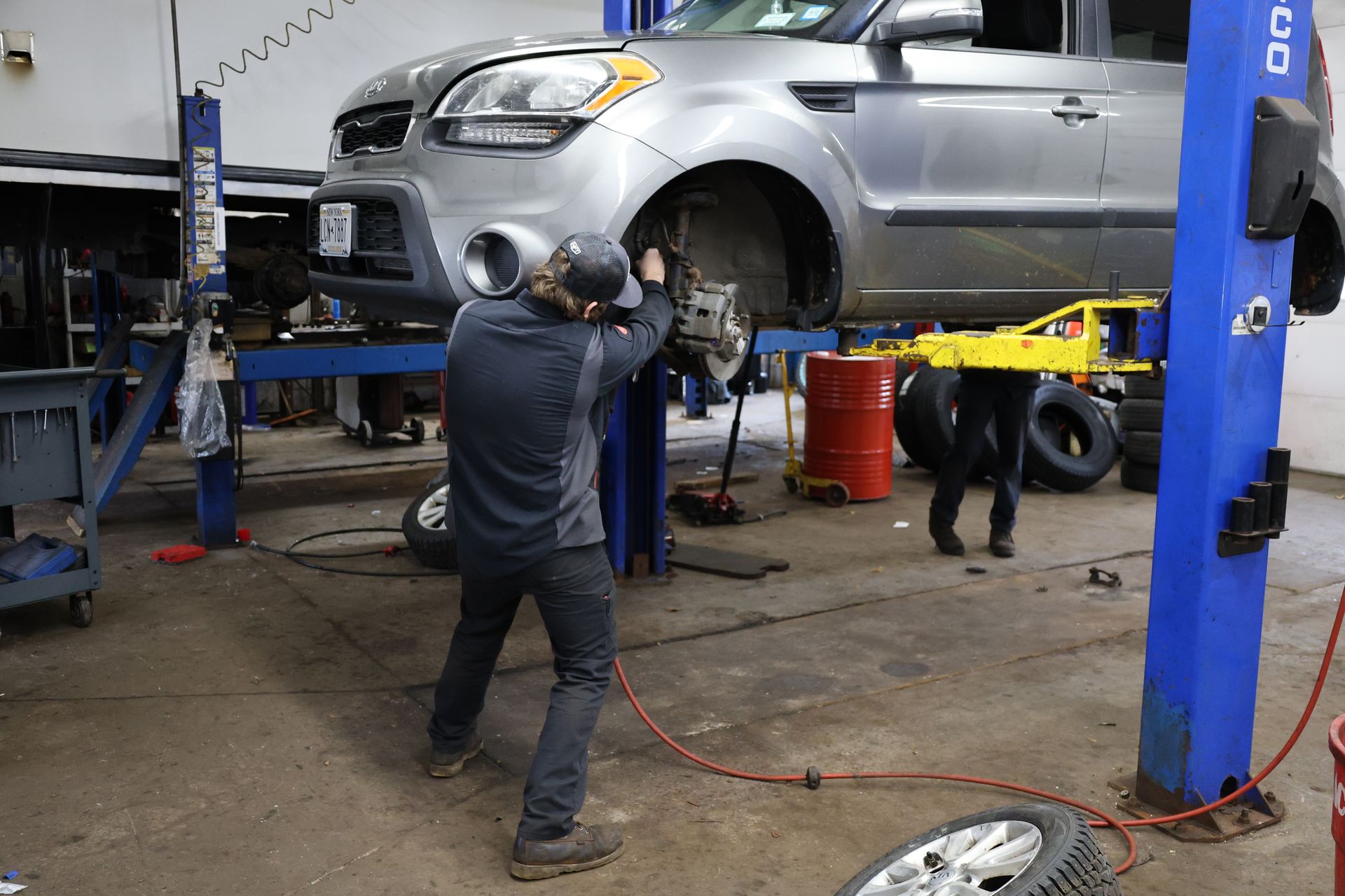 Mechanic Working on Suspension | Kolb Family Automotive