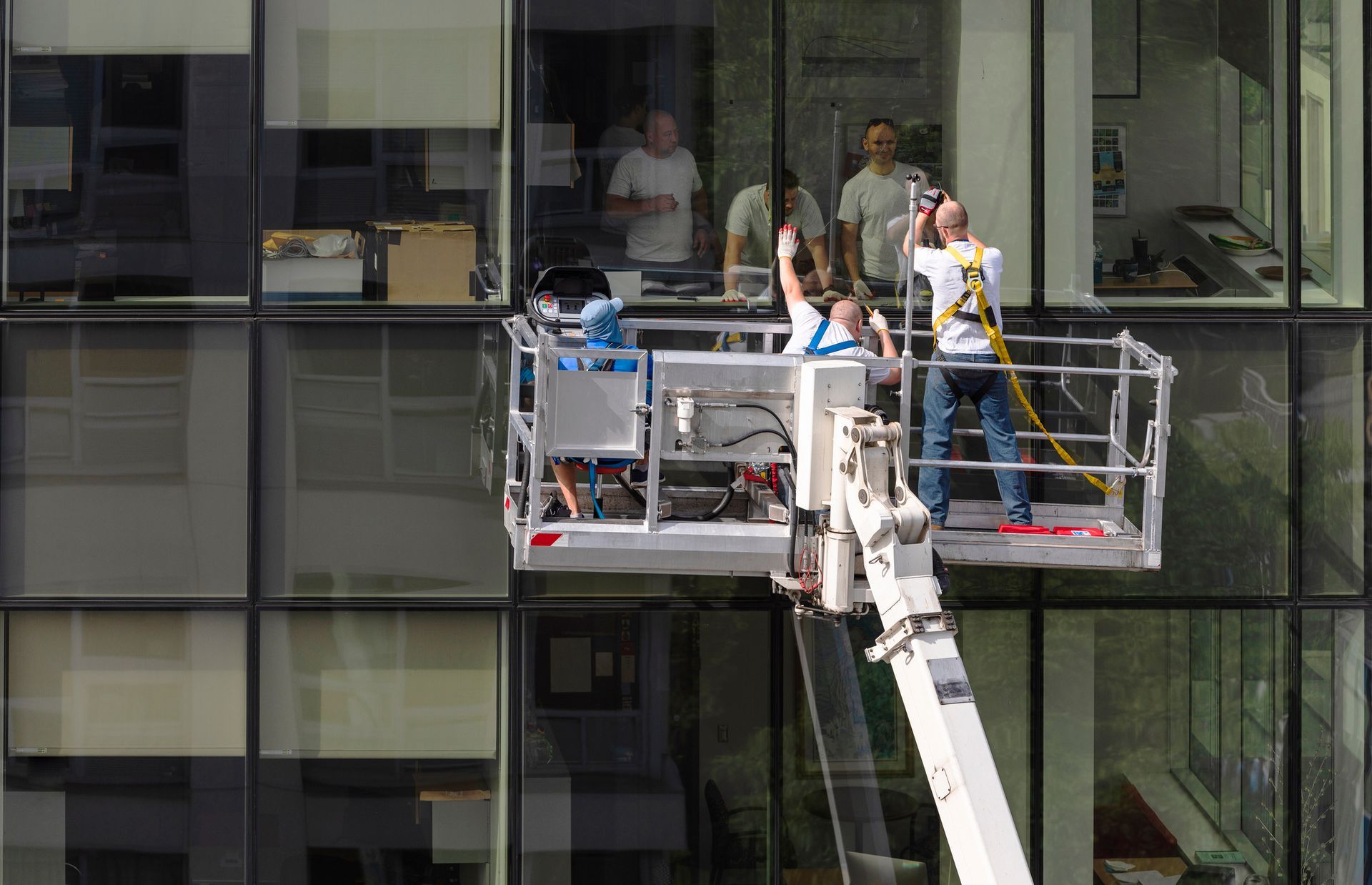 A group of men are working on a large building.