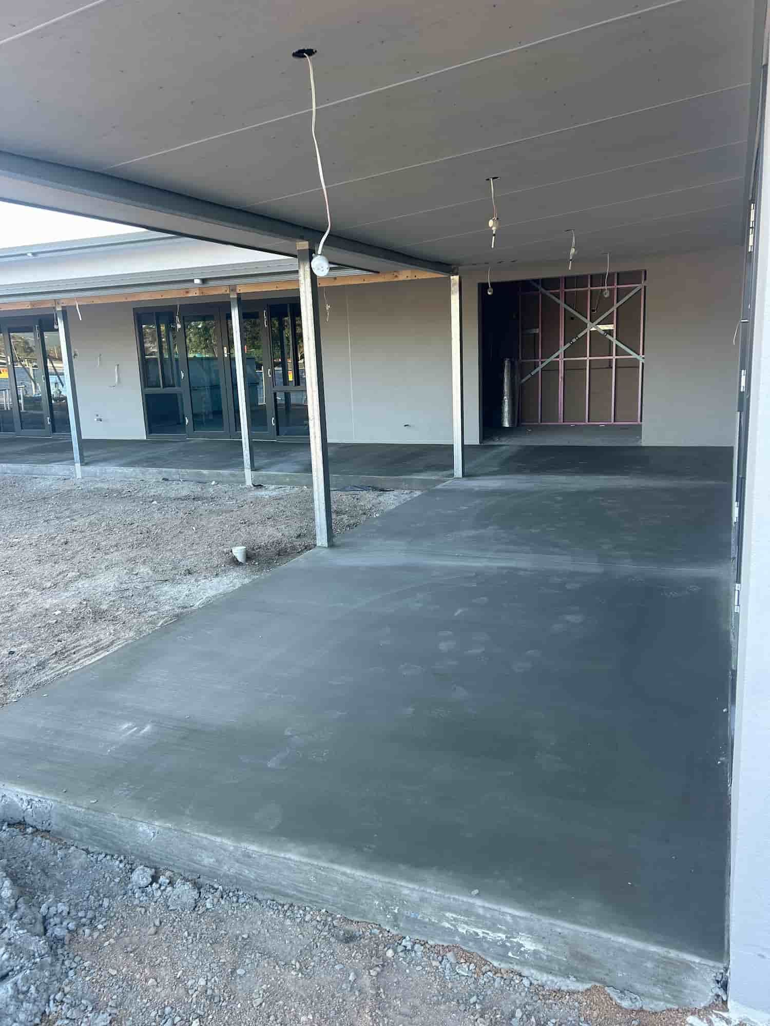 A Concrete Walkway Leading to a Building Under Construction — Diamond Concreting In Mount Low, QLD