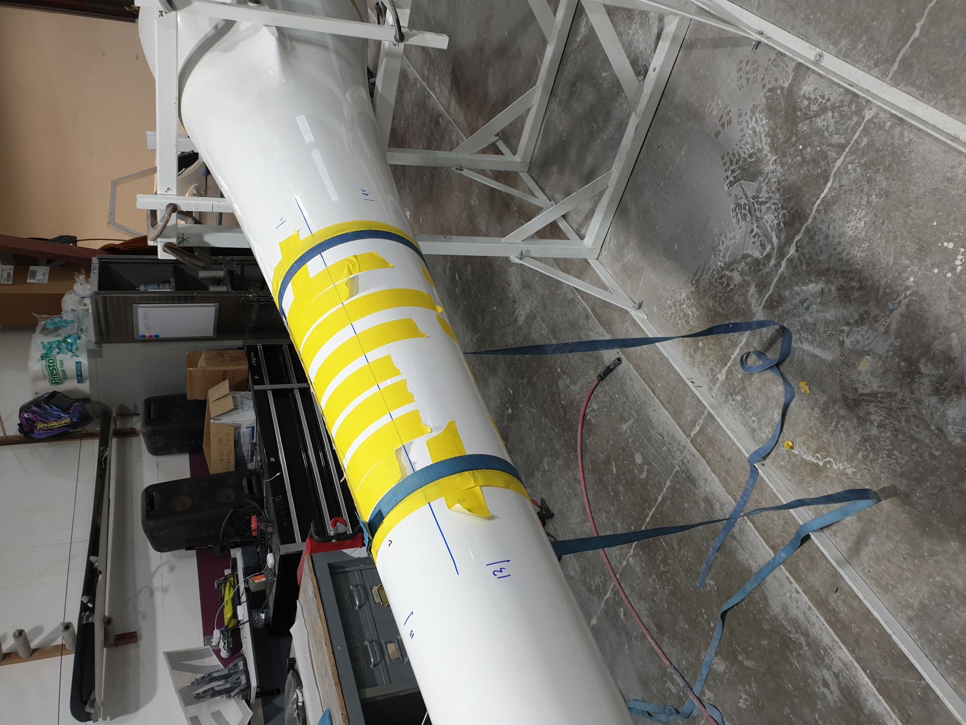 A large white pipe with a yellow arrow on it