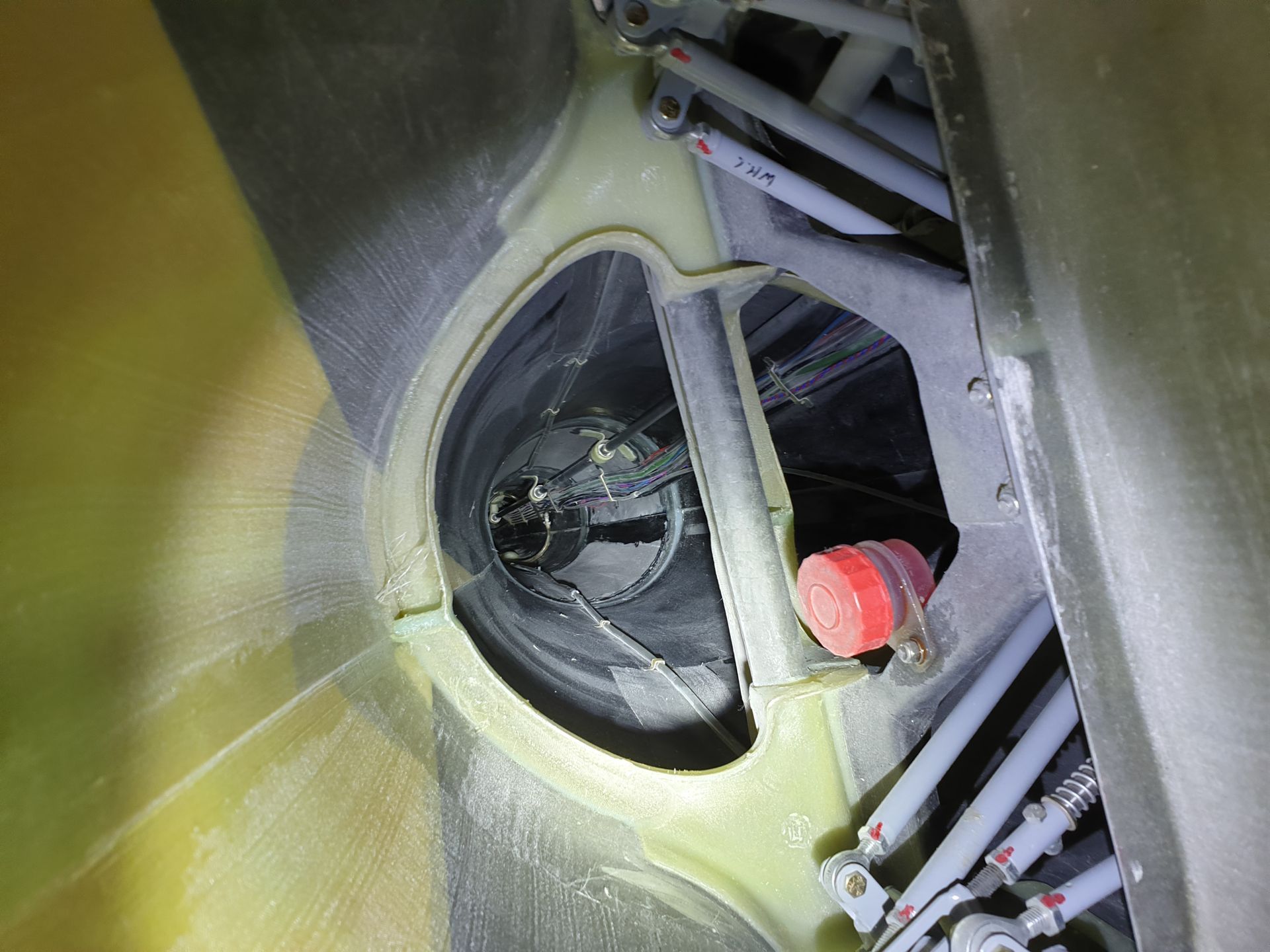 A close up of a machine with a red cap on it.