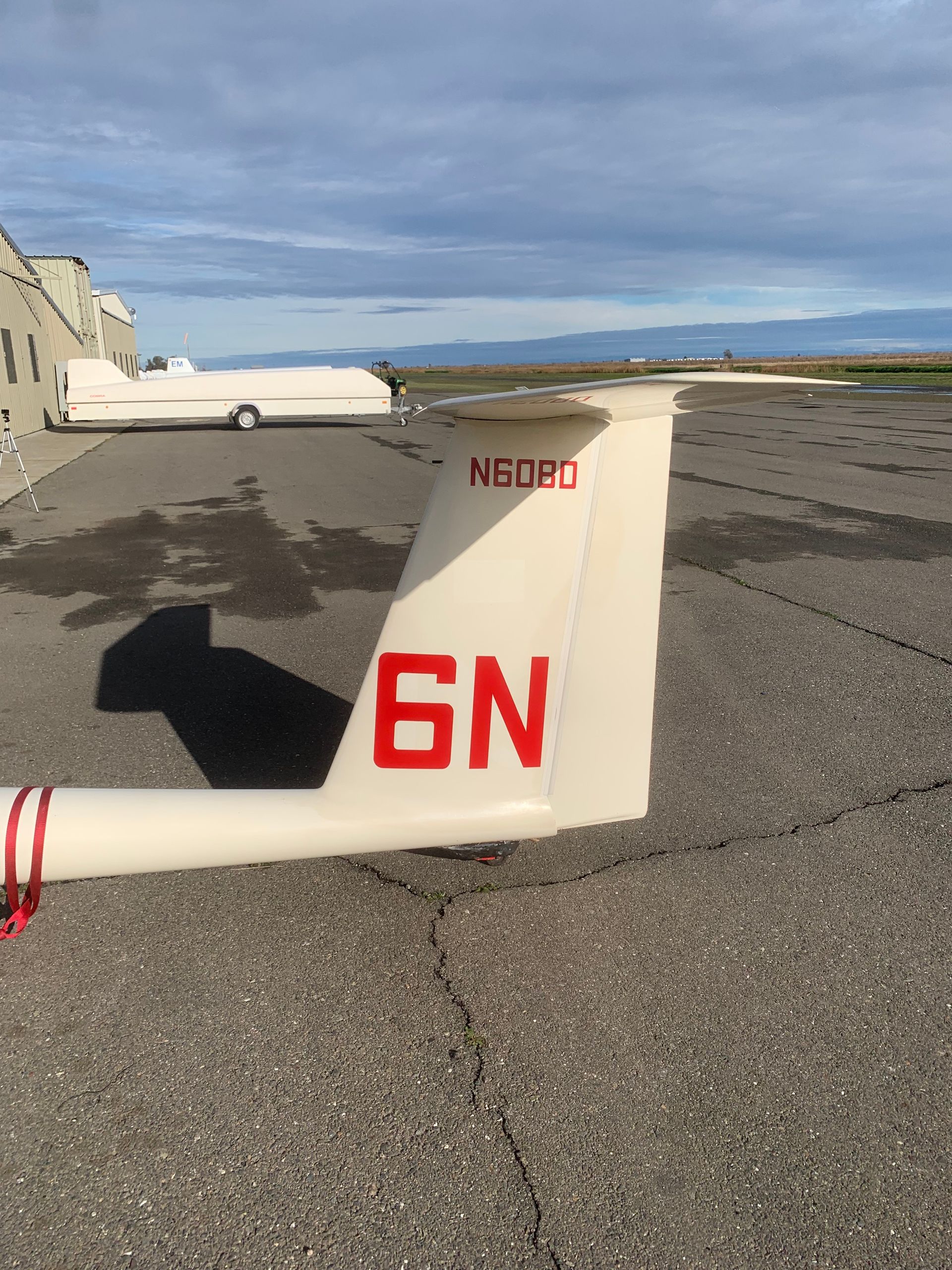 A white plane with the number 6n on the tail