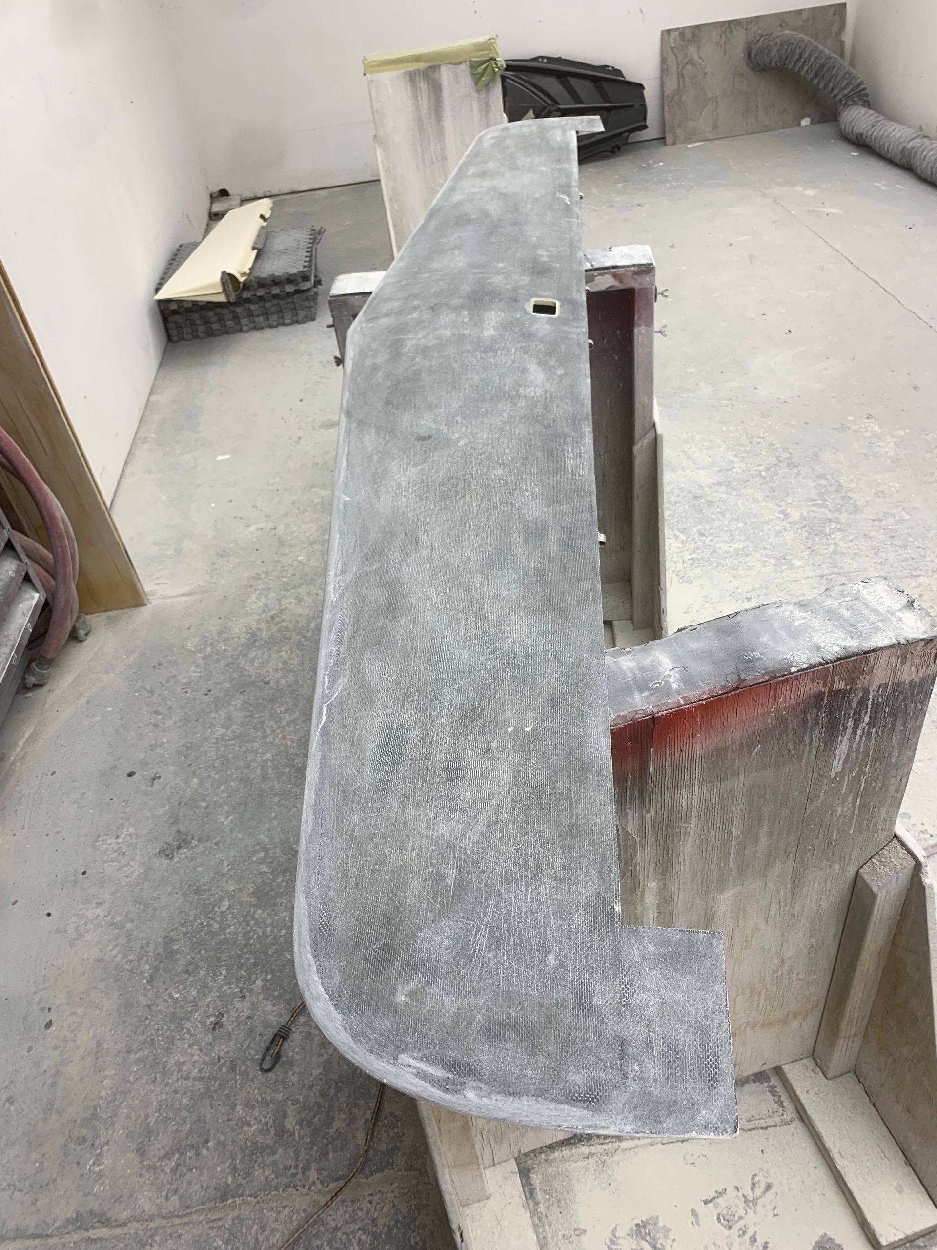A piece of concrete is sitting on a table in a room.