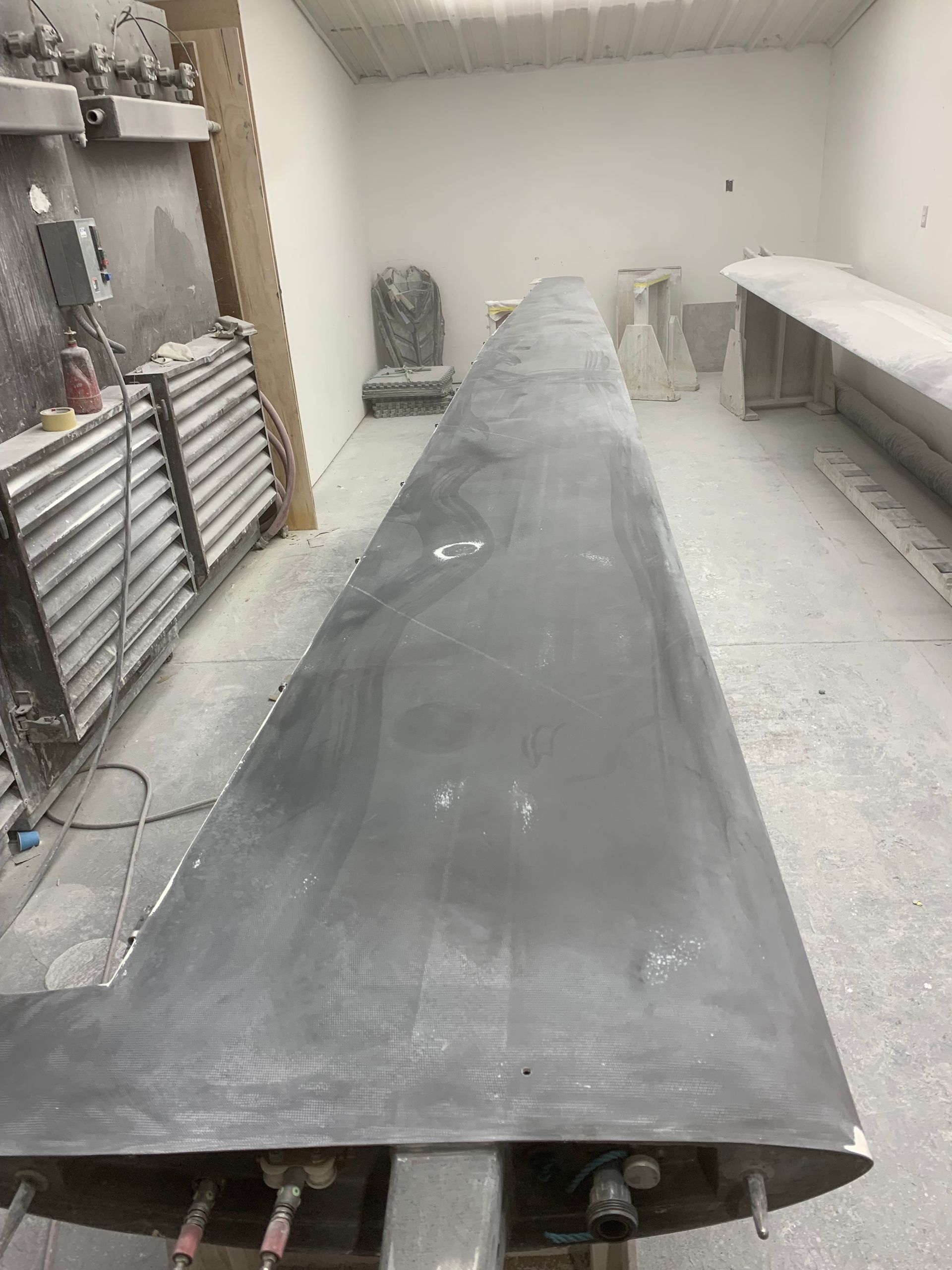 A large piece of metal is sitting on a table in a room.