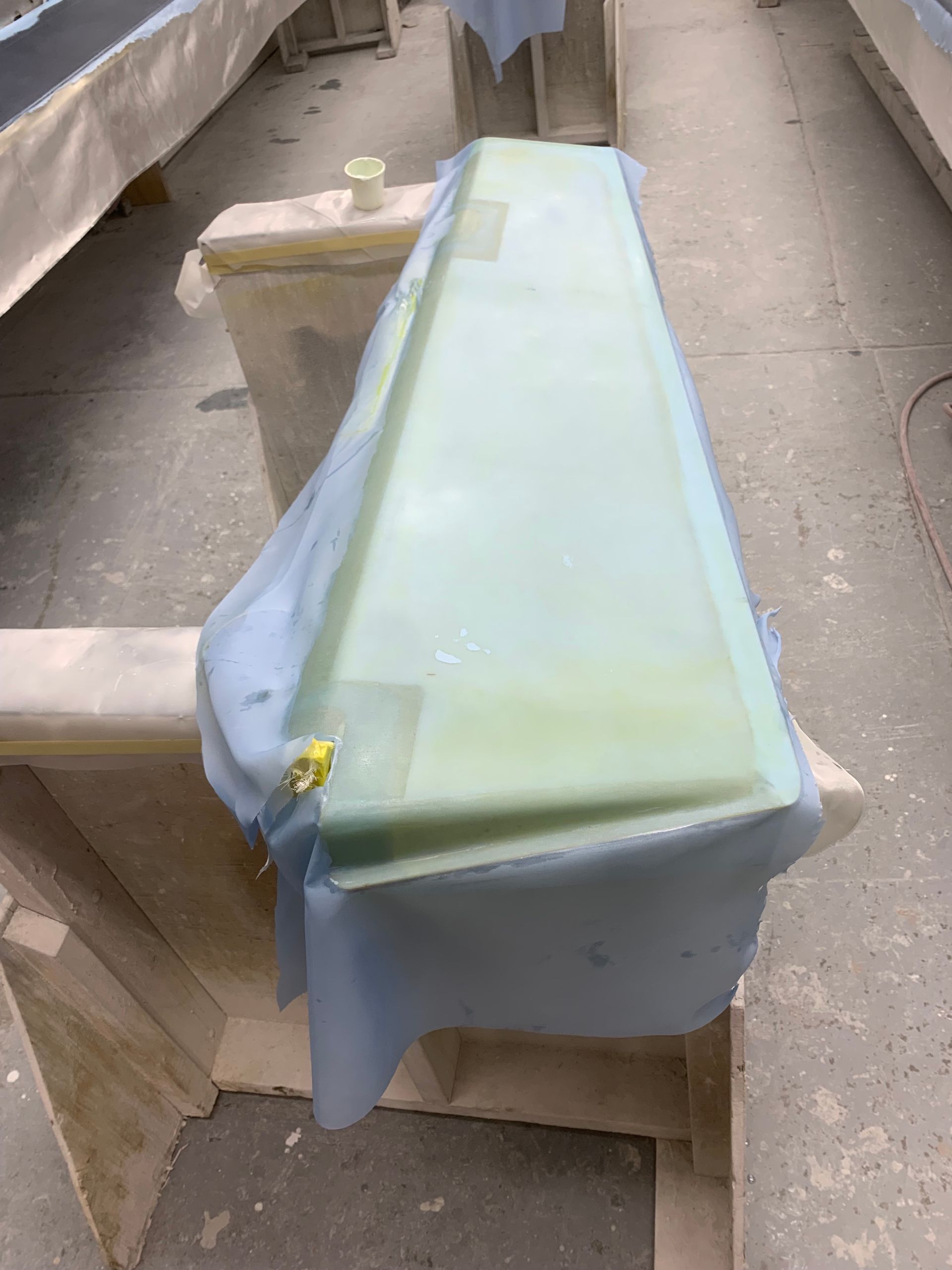 A piece of plastic is sitting on top of a wooden table.