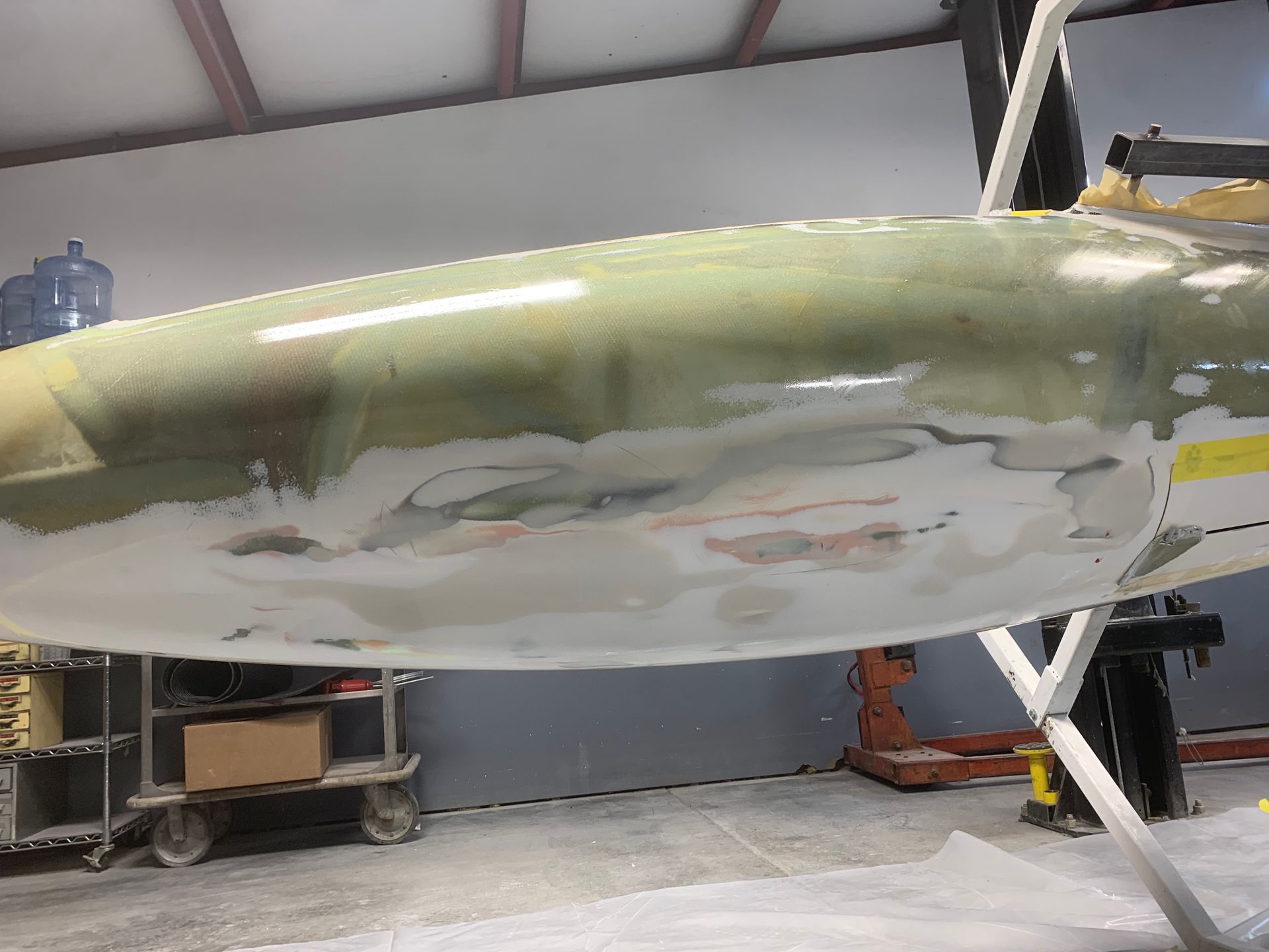 A large piece of plastic is sitting on a stand in a room.