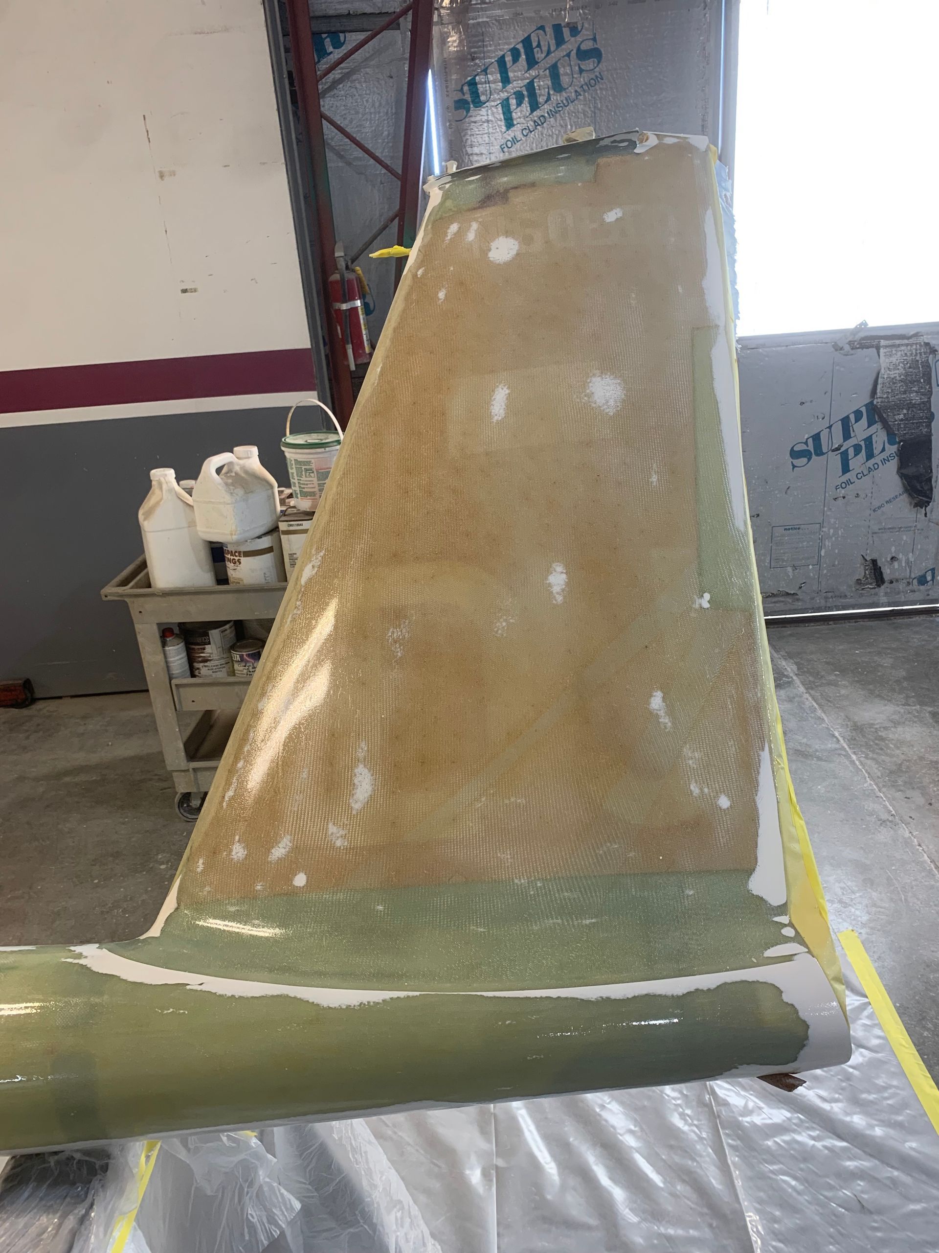 A piece of plastic is sitting on a table in a room.