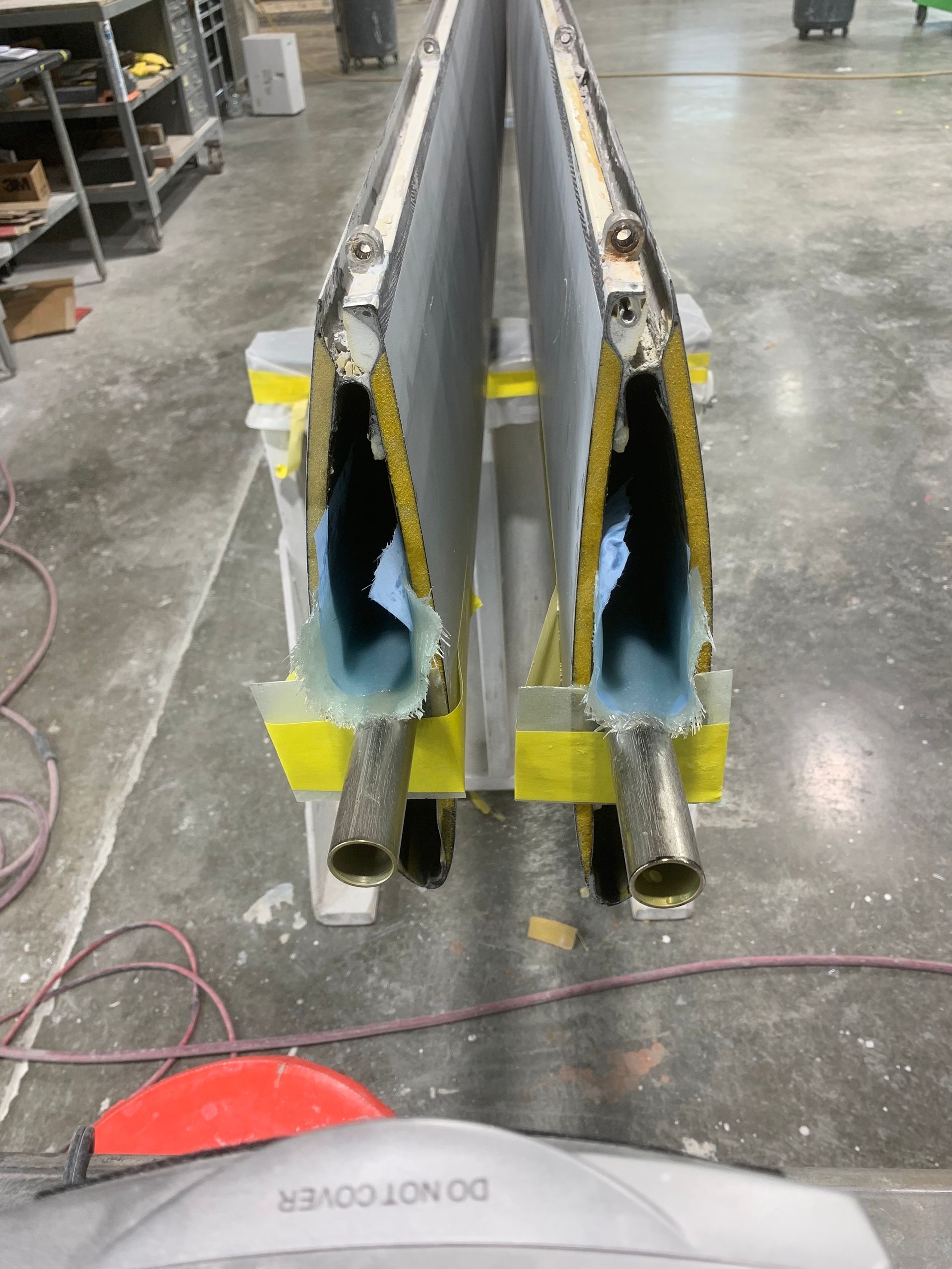 A do not cover sign is taped to a piece of metal